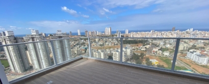 a balcony with a view of a city