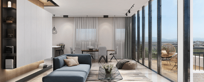A living room with large windows and a balcony.
