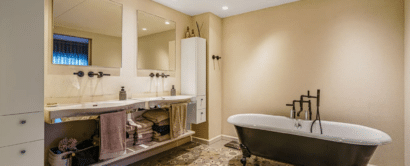 A bathroom with a tub and sink.