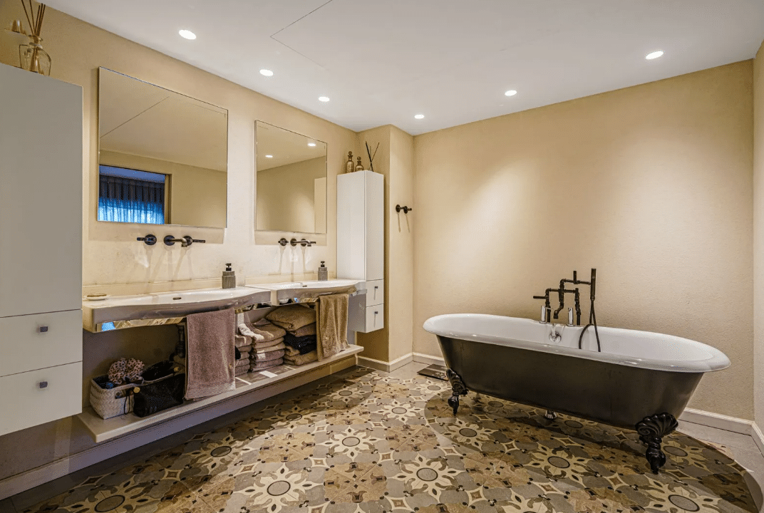 A bathroom with a tub and sink.